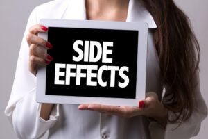 What should I do if I experience side effects from taking Olmezest?